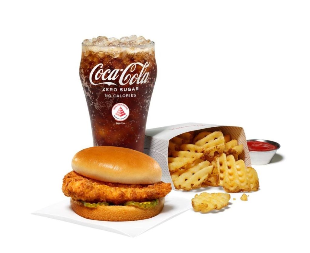 Chick-fil-A Original Chicken Sandwich with Waffle Fries, Coca Cola and sauce